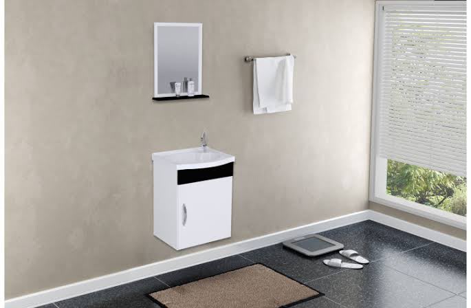 Gabinete suspenso branco AJ Rorato de 39 cm, com cuba e detalhe frontal preto, instalado em banheiro.